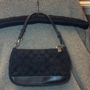 Coach signature C Black leather trim wristlet.